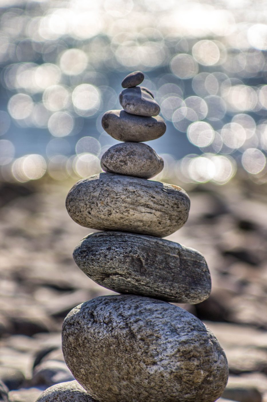 Balanced stones on a shoreline